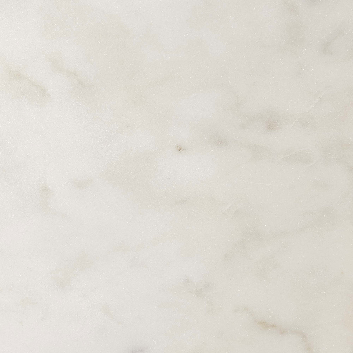 The white marble surface reveals delicate tonal variations and subtle veining for understated elegance || EEI-6609-BRA-WHI || swatch_studio