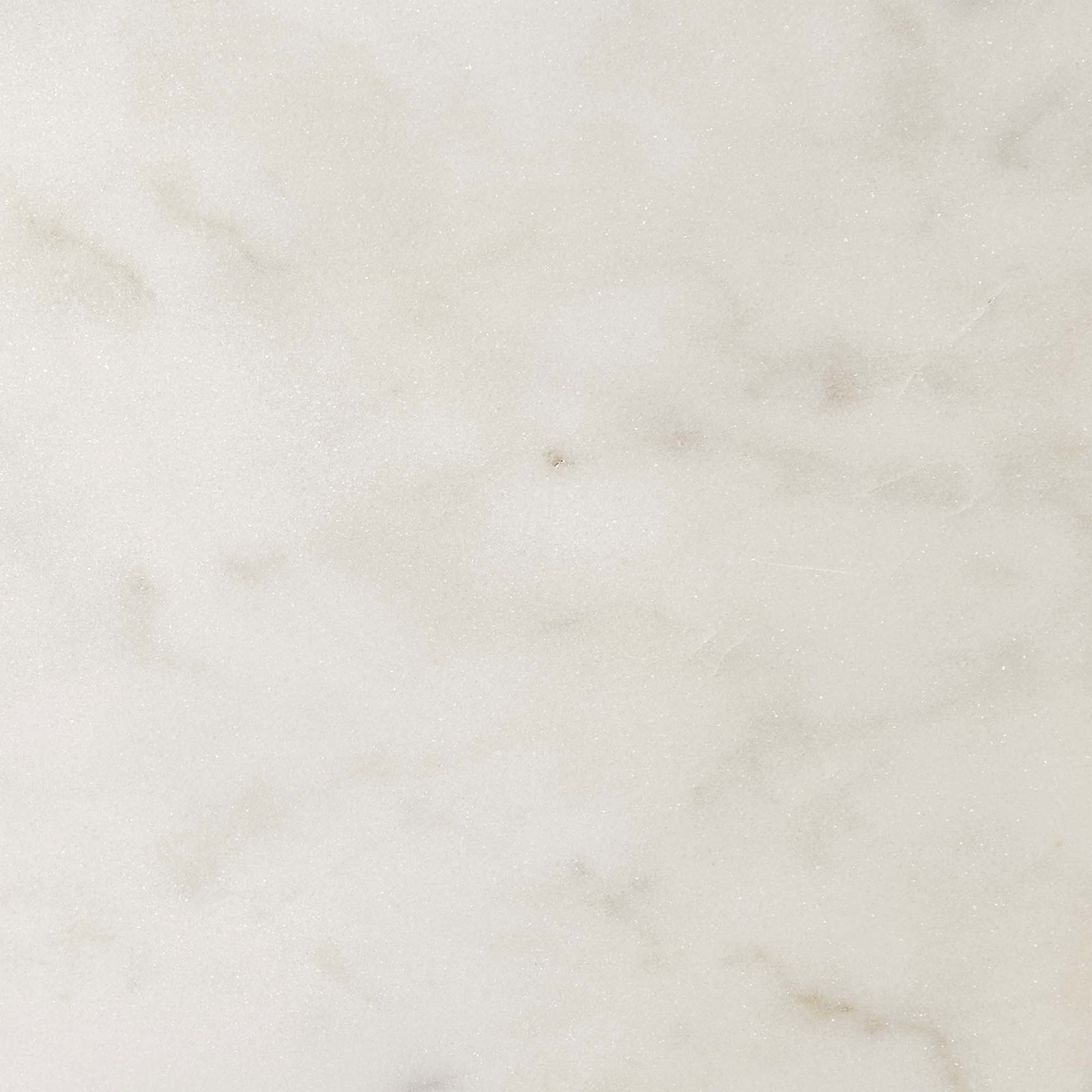 The white marble surface reveals delicate tonal variations and subtle veining for understated elegance || EEI-6609-BRA-WHI || swatch_studio