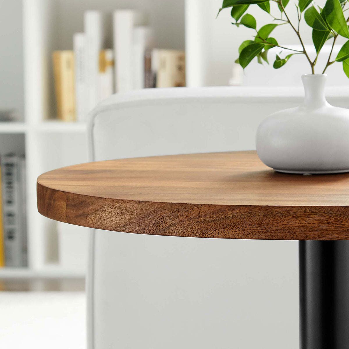 Viva side table beside sofa styled with vase to showcase warm acacia top in modern room || EEI-6610-BLK-LOC || detail_room