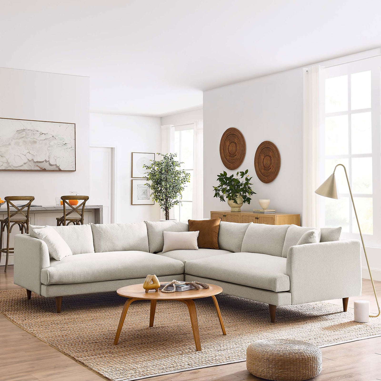 Ivory sectional sofa anchored in a bright living room with wood accents, floor lamp, and woven area rug || EEI-6613-HEI || front_angle_room