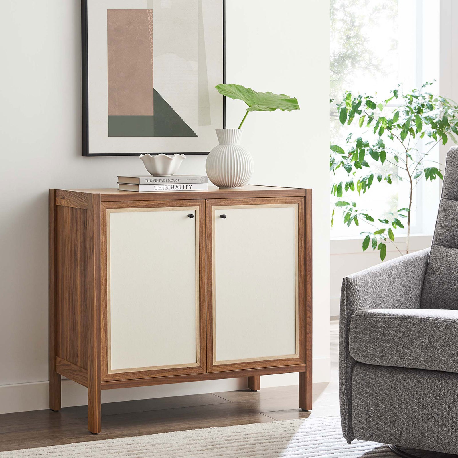 Capri sideboard styled in a living room with art, greenery, and decor for an inviting modern vignette || EEI-6615-WAL || front_angle_room