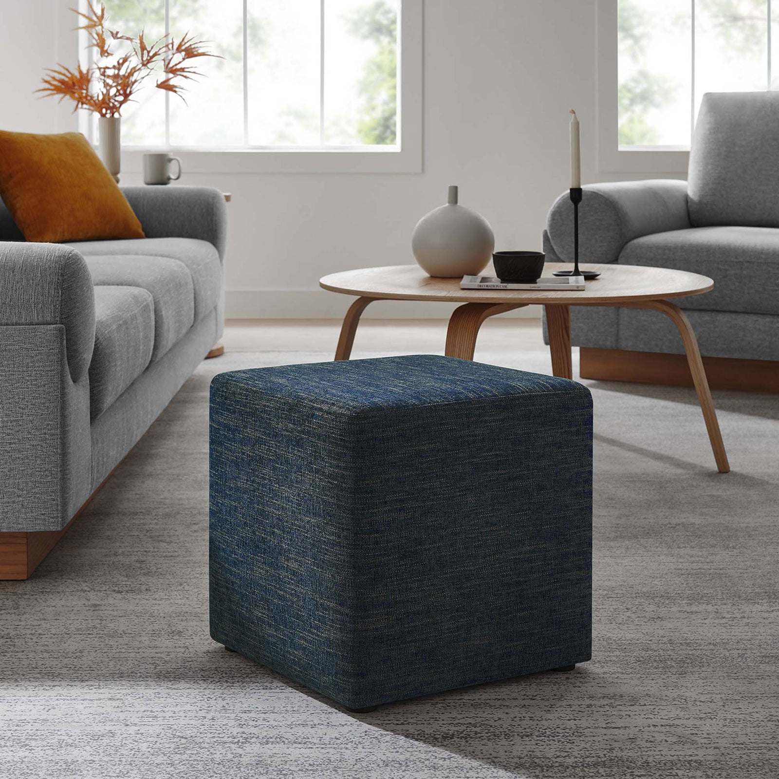 Heathered azure ottoman centered in a cozy living room, complementing contemporary seating and decor || EEI-6636-HEA || front_angle_room