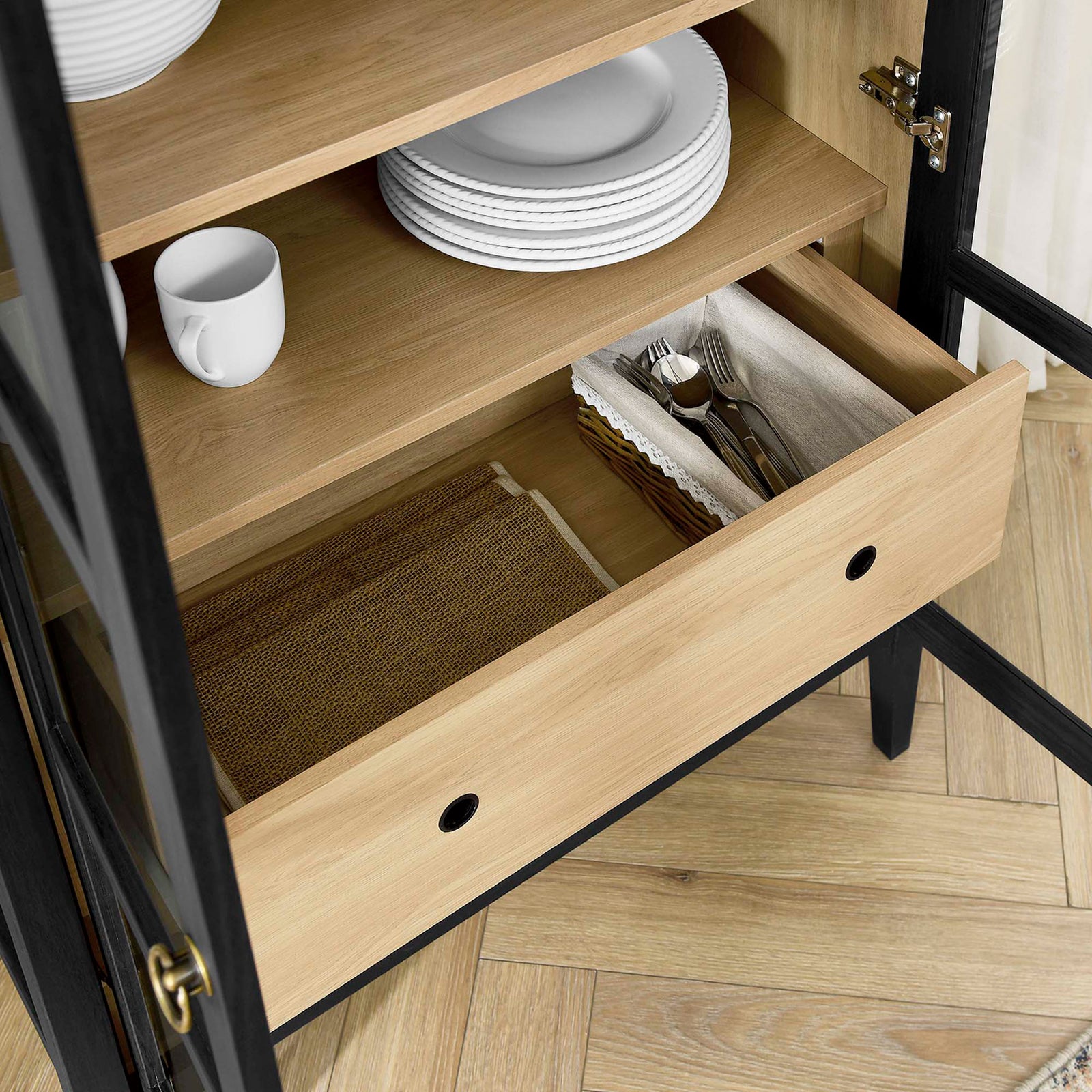 Lower drawer of black oak cabinet neatly organizes plates, flatware, and table linens || EEI-6639-BLK-OAK || storage_open_room