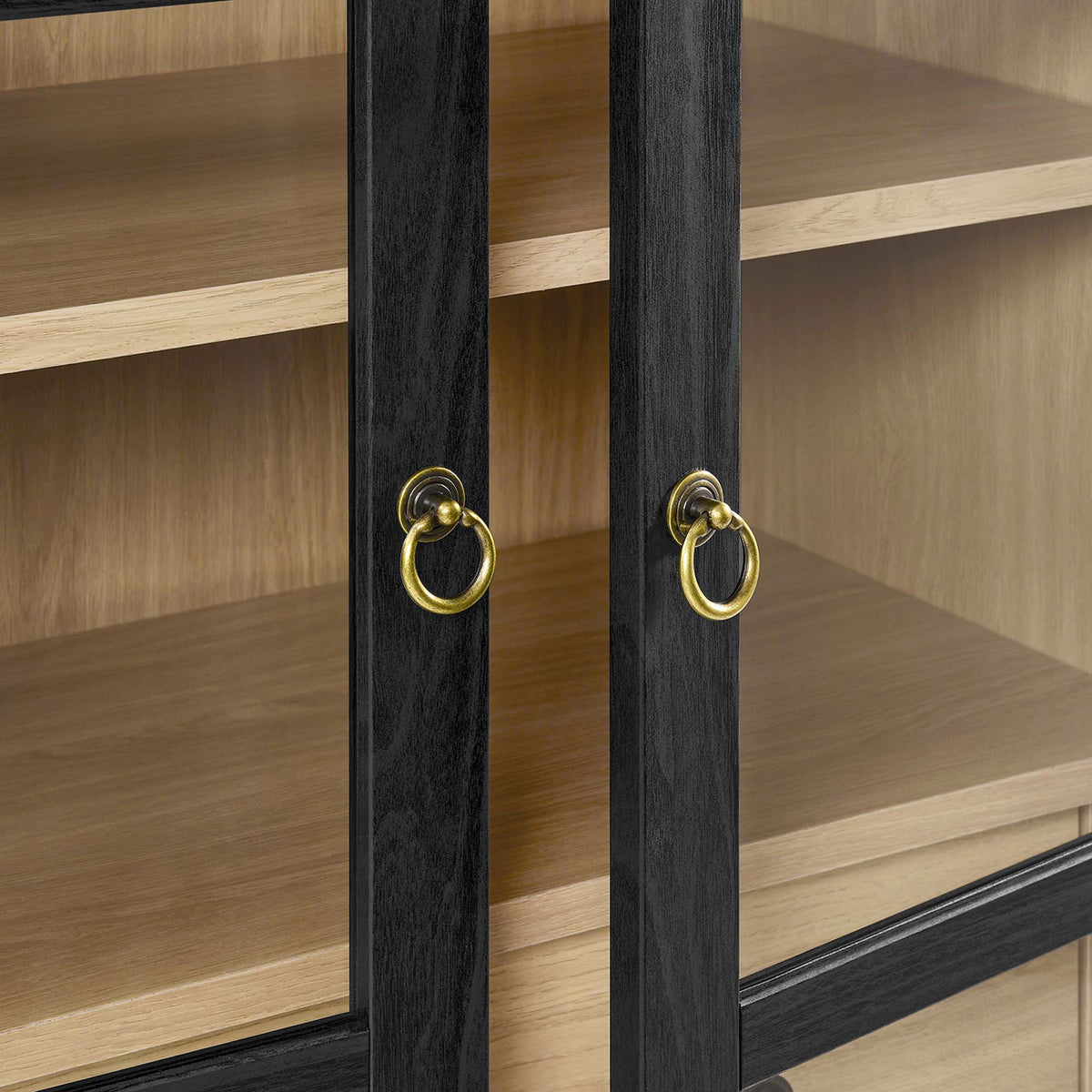Brushed gold metal ring pulls add a refined touch to the black oak glass doors || EEI-6639-BLK-OAK || handle_studio