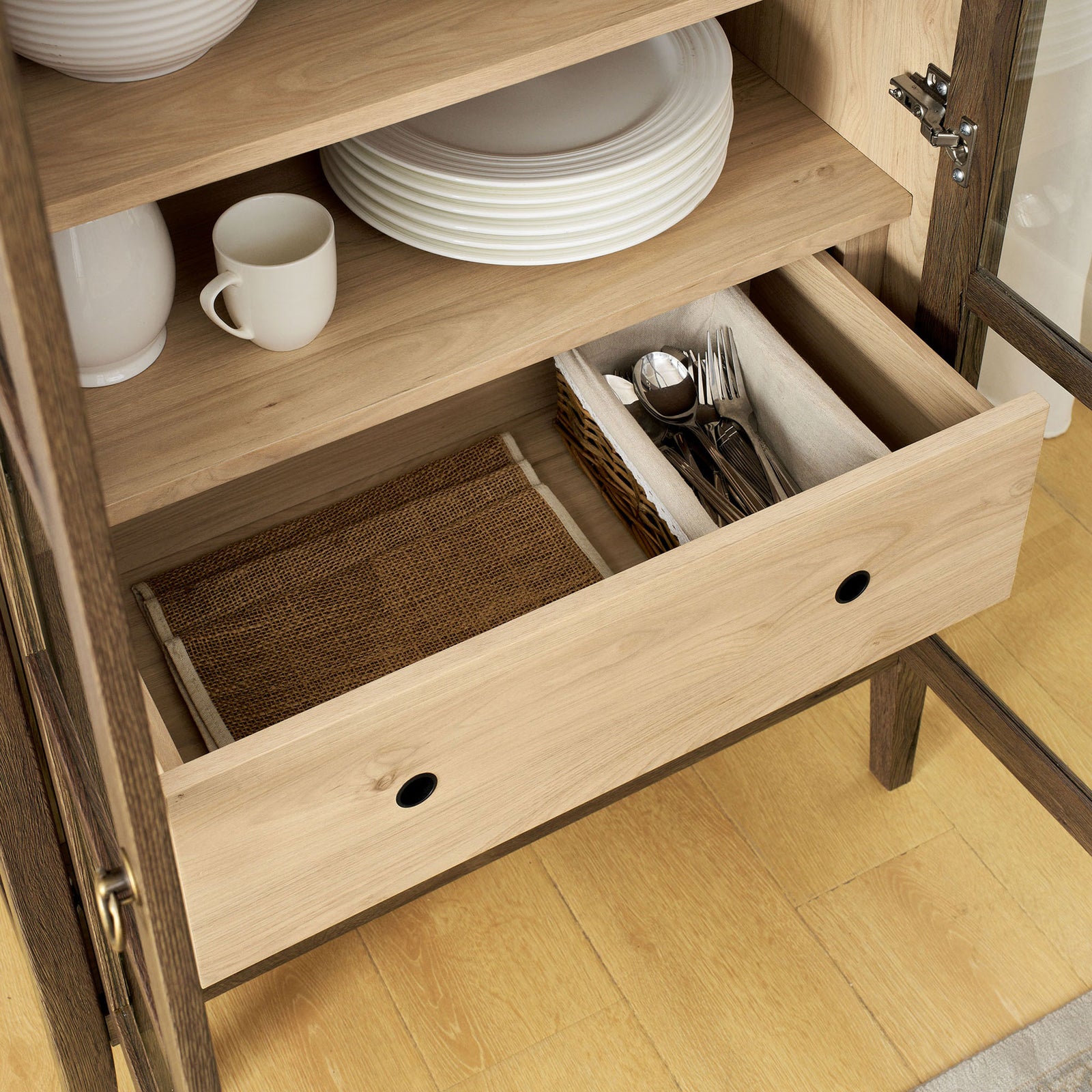 Lower drawer of the walnut hickory cabinet organizing cutlery, napkins, and small accessories || EEI-6639-WAL-HCK || storage_open_room