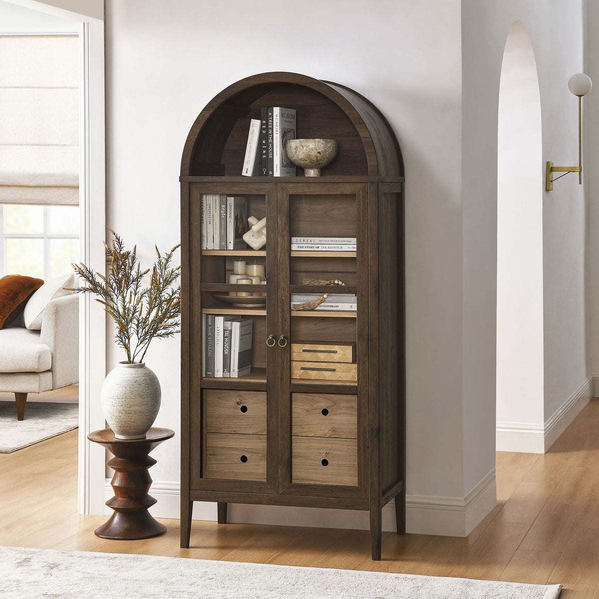 Walnut hickory cabinet filled with books and decor, adding warmth to a hallway or living room || EEI-6639-WAL-HCK || front_angle_room