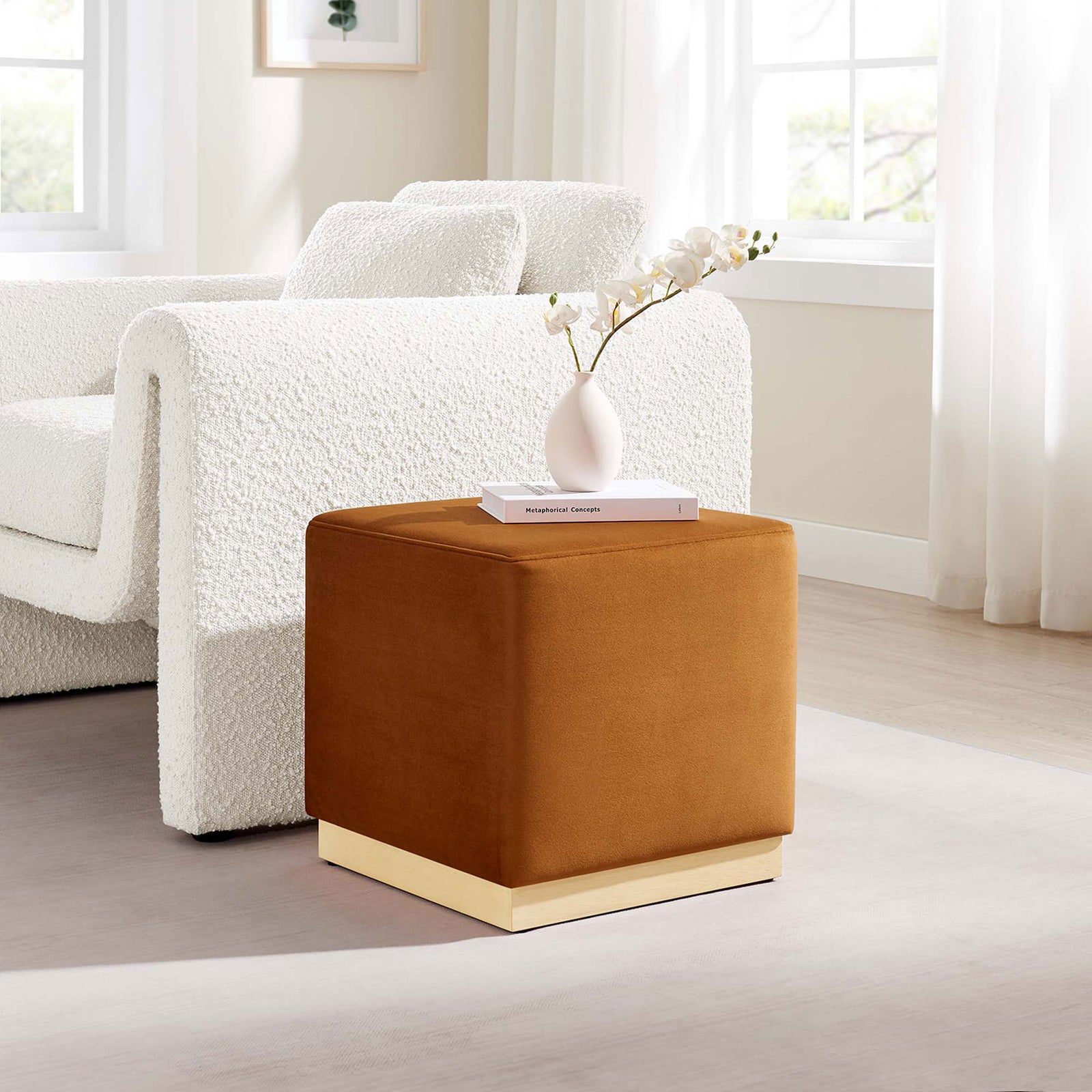 Rust velvet cube ottoman beside a white sofa, styled as a chic accent in a sunlit living room || EEI-6640-RUS-NAT || front_angle_room