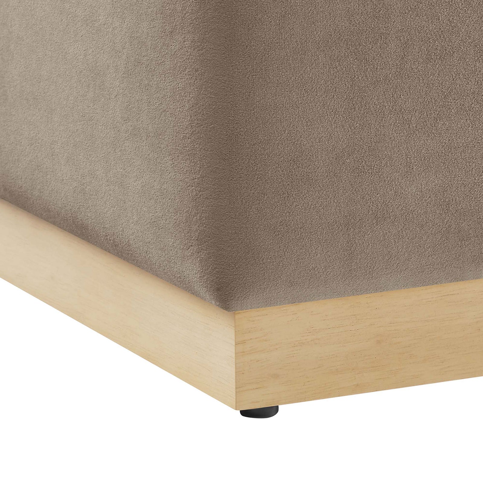 Detail of the soft velvet upholstery, natural wood plinth base, and protective nonmarking glides. || EEI-6640-TAU-NAT || leg_studio