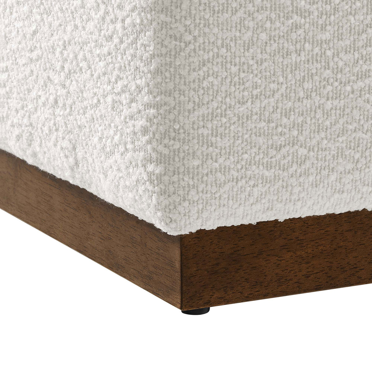 Walnut plinth base with protective feet pairs with textured boucle upholstery for sturdy support and a soft feel. || EEI-6641-CLO-WAL || leg_studio