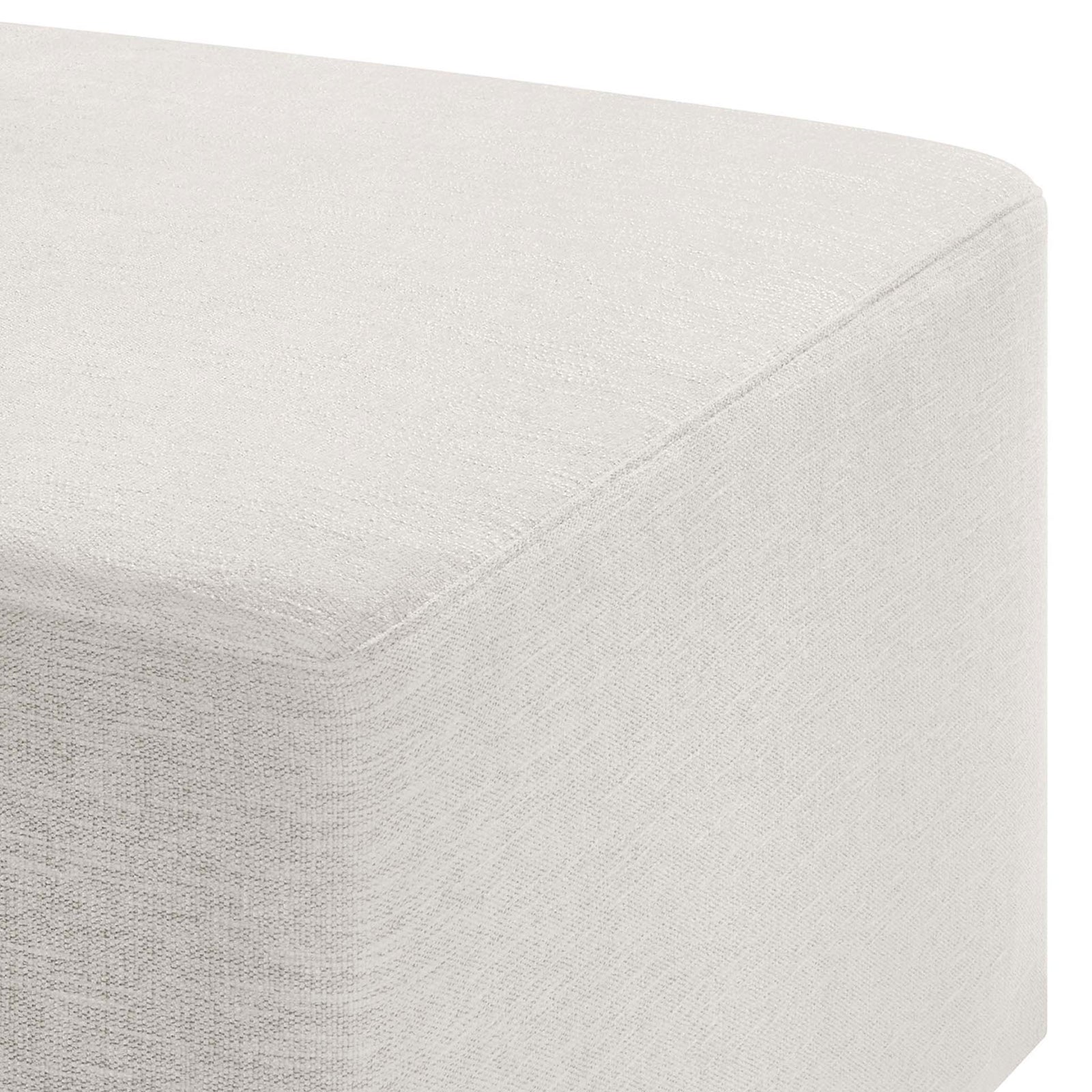 Heathered ivory fabric and smooth padding highlight the ottoman's softly rounded corner || EEI-6642-HEI || detail_studio