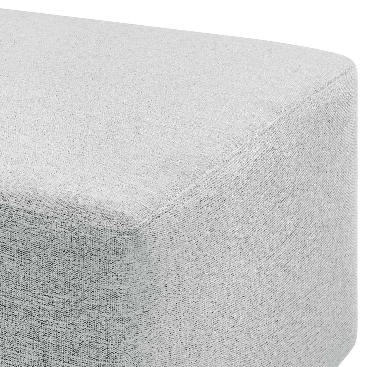 Detail of the heathered weave fabric and softly rounded edges that give this light gray ottoman a refined look || EEI-6642-HLG || detail_studio