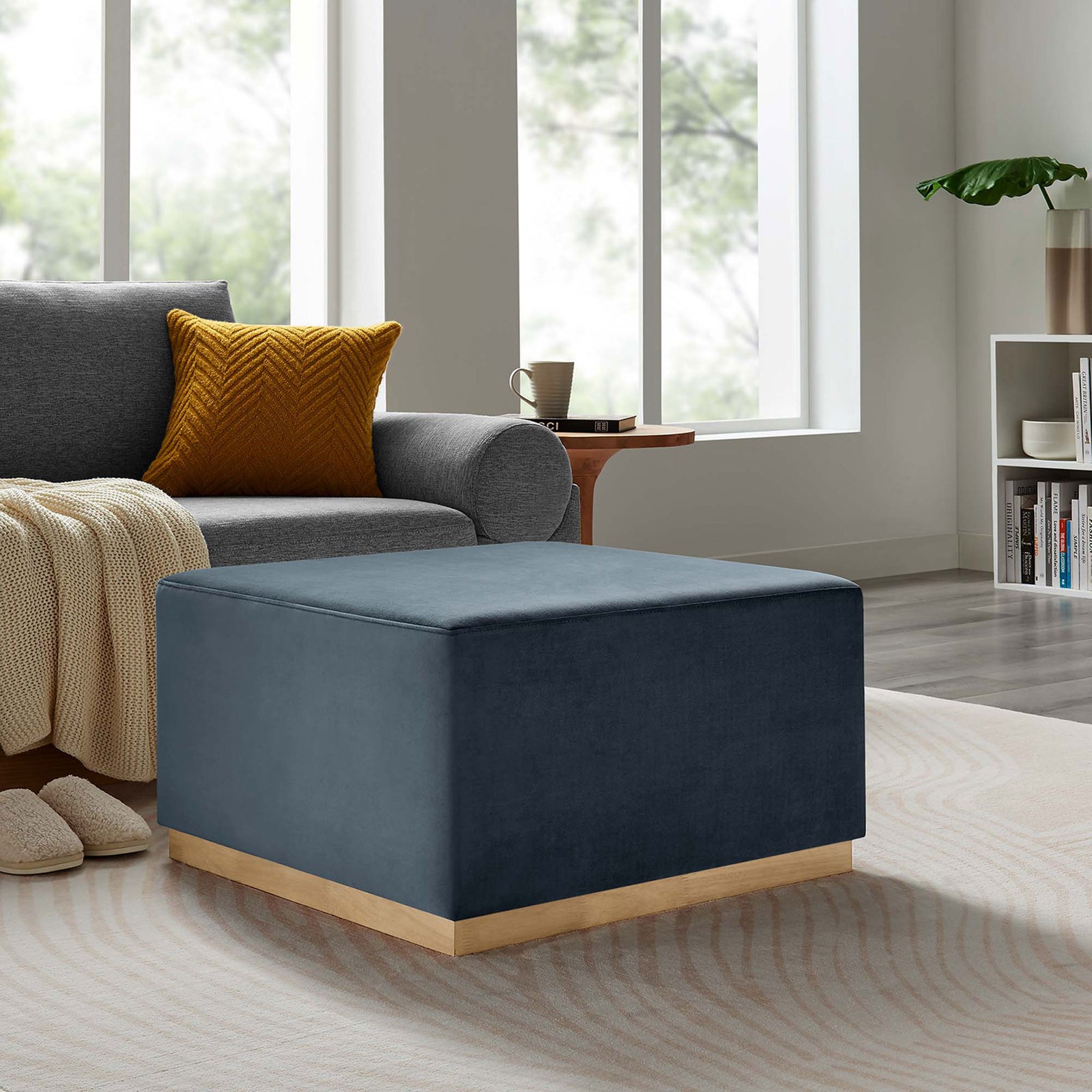 Generous ottoman adds plush cadet blue seating and a natural wood accent to this cozy contemporary lounge || EEI-6643-CAB-NAT || front_angle_room