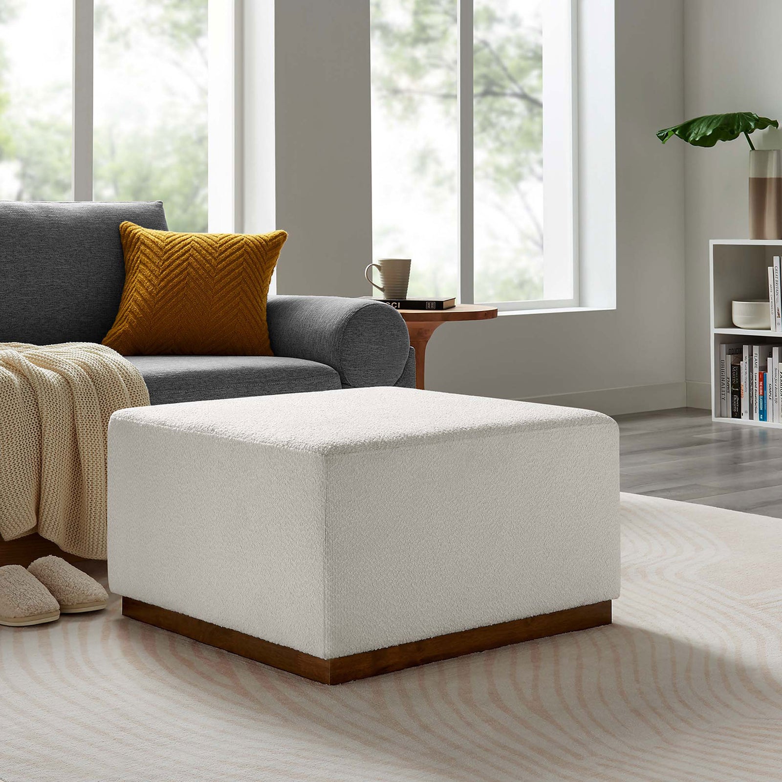Cloud boucle ottoman adds soft texture and warmth in a cozy seating corner with layered accents. || EEI-6644-CLO-WAL || front_angle_room