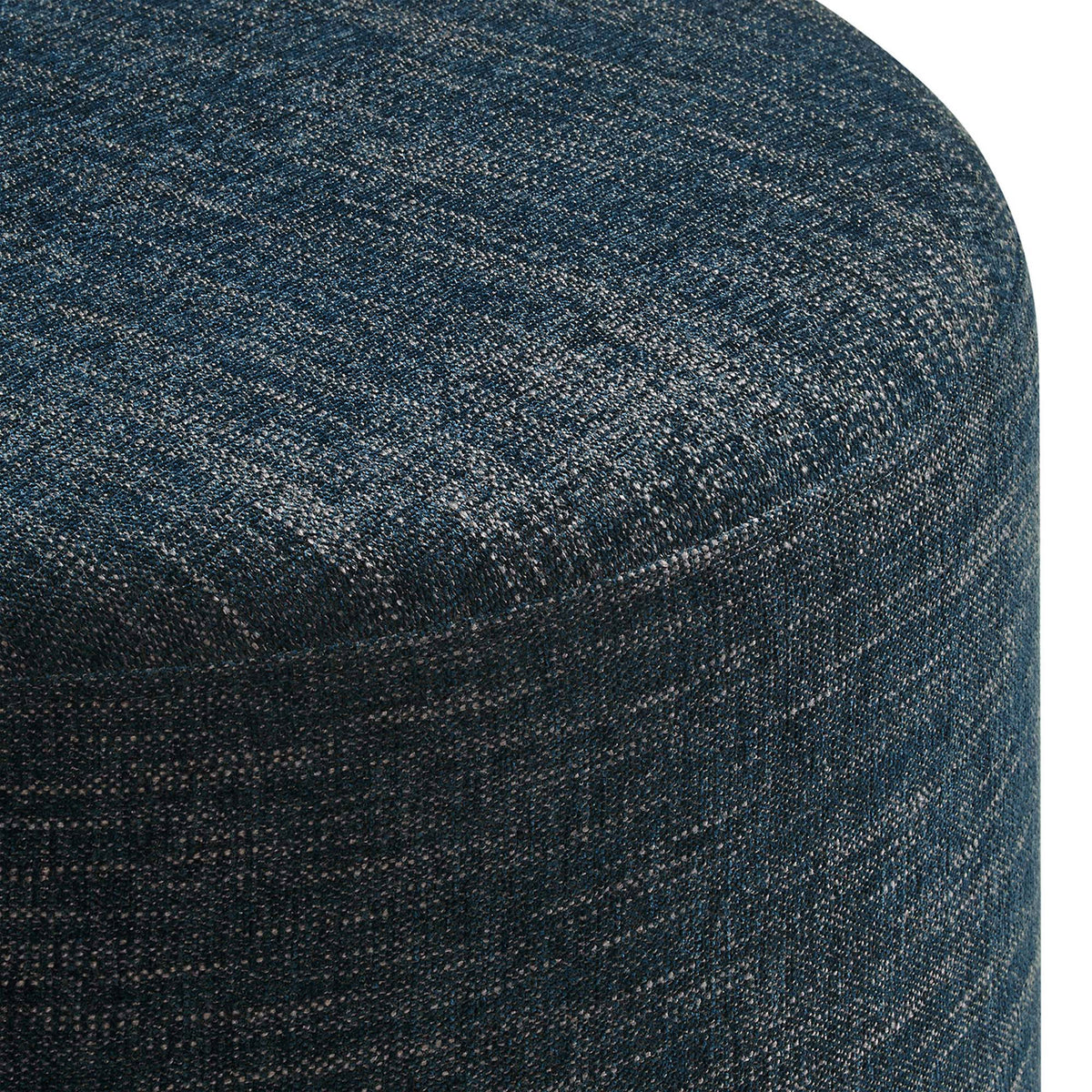 Heathered weave upholstery shows rich blue tones and subtle texture around the ottoman's curved edge || EEI-6645-HEA || detail_studio