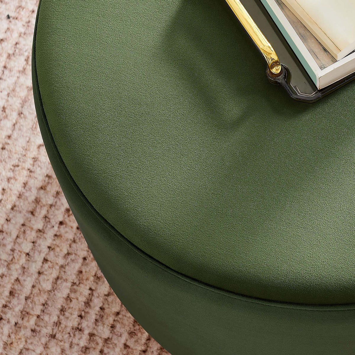 Moss green velvet ottoman styled as a chic coffee table atop a textured blush area rug. || EEI-6646-MOG-NAT || detail_room