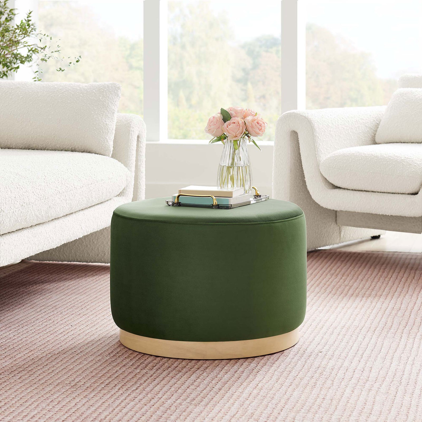 Moss green round velvet ottoman adds a modern accent between plush white sofas in a bright living room. || EEI-6646-MOG-NAT || front_angle_room