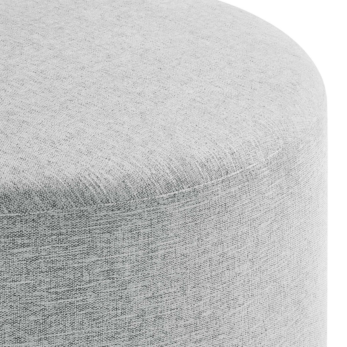 Textured woven heathered fabric and tailored seam detail on the light gray round ottoman || EEI-6647-HLG || detail_studio