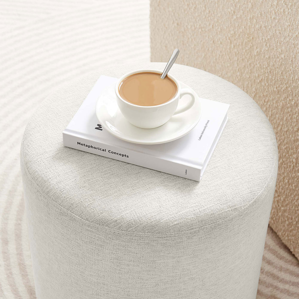 Ottoman serves as a petite ivory perch for your coffee and book, adding cozy function to modern decor. || EEI-6651-HEI || detail_room