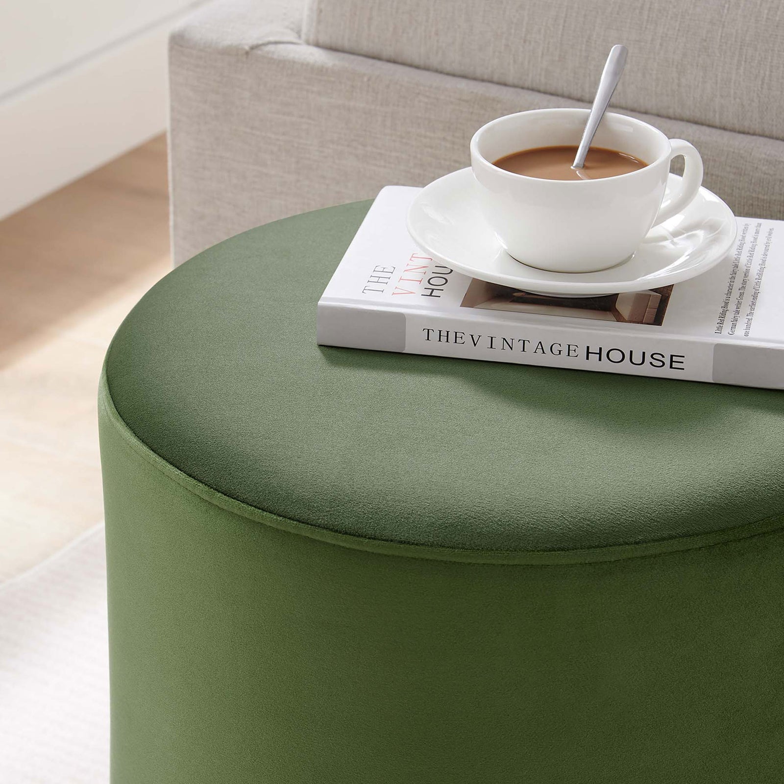 Moss green ottoman doubles as a chic side table for coffee and books in a cozy living room || EEI-6652-MOG-NAT || detail_room