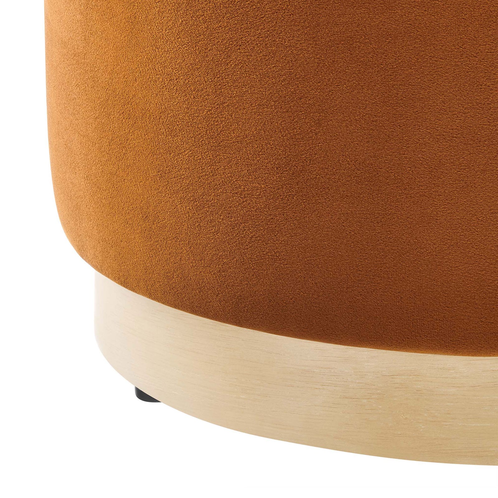 Rich rust velvet upholstery meets a natural wood plinth base, highlighting the ottoman's texture and modern style || EEI-6652-RUS-NAT || detail_studio