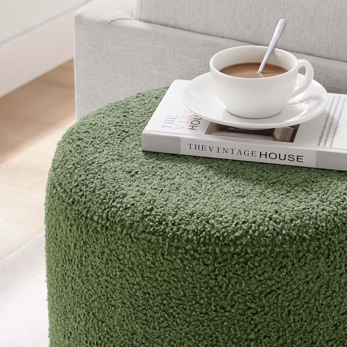 Sherpa ottoman used as a casual tabletop for coffee and books in a light, inviting living space || EEI-6653-MOG-NAT || detail_room
