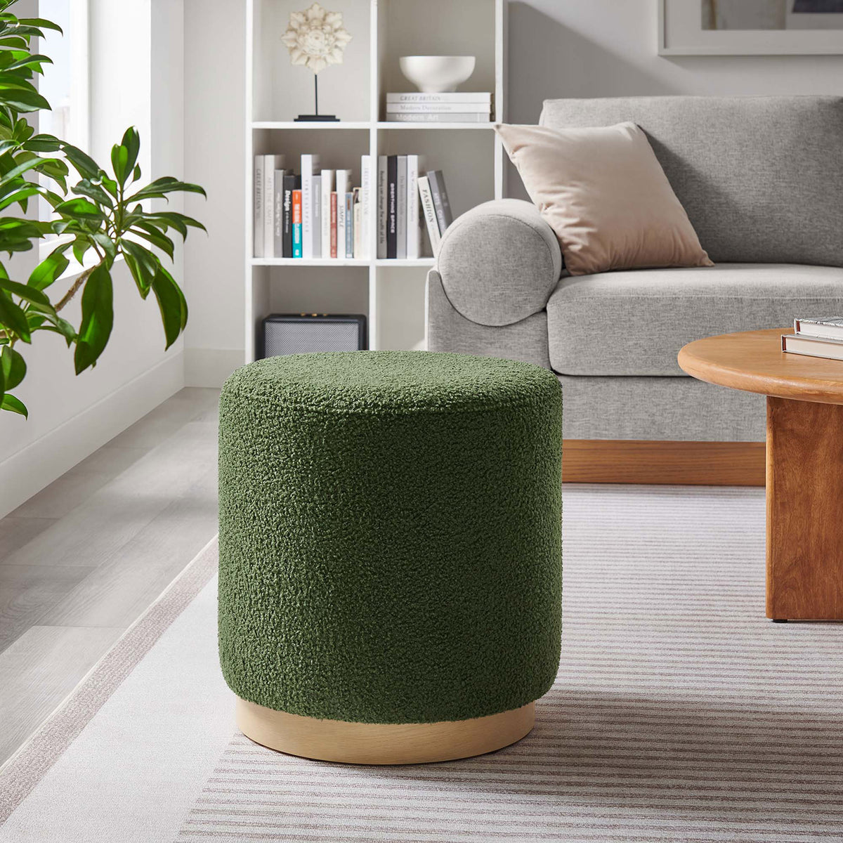 Round sherpa ottoman adds a pop of moss green color and soft texture to this contemporary living room || EEI-6653-MOG-NAT || front_room