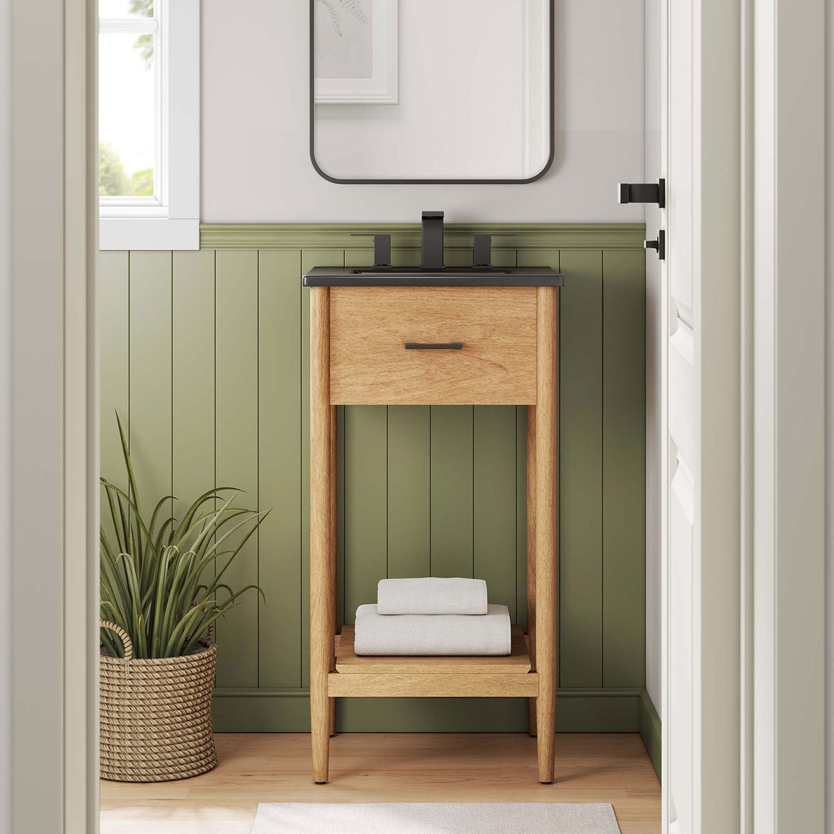 Styled in a cozy bathroom, the vanity adds warmth with natural wood and a sleek black ceramic sink. || EEI-6659-NAT-BLK || front_room