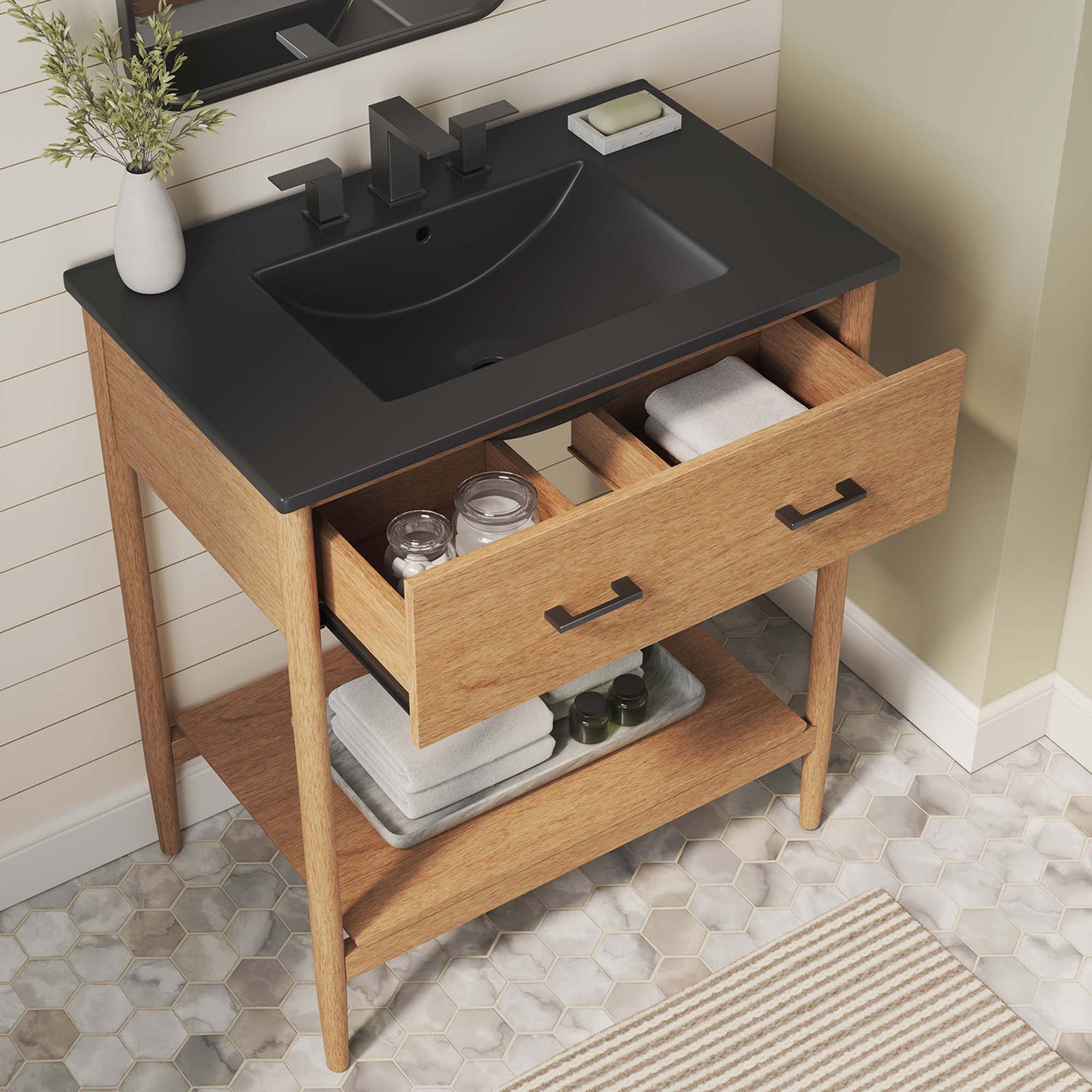 Open drawer reveals organized storage with black basin and warm wood tones in a bright bath || EEI-6663-NAT-BLK || top_angle_open_room