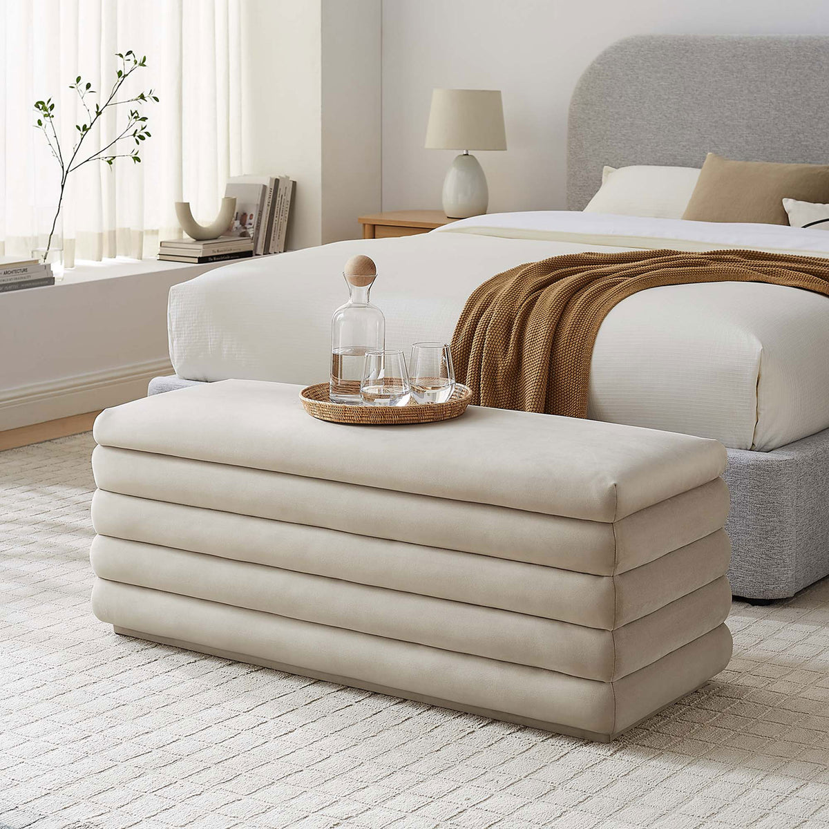 Chic bedroom accent with plush channels and calm almond hue, perfect at the foot of the bed. || EEI-6664-ALM || front_angle_room