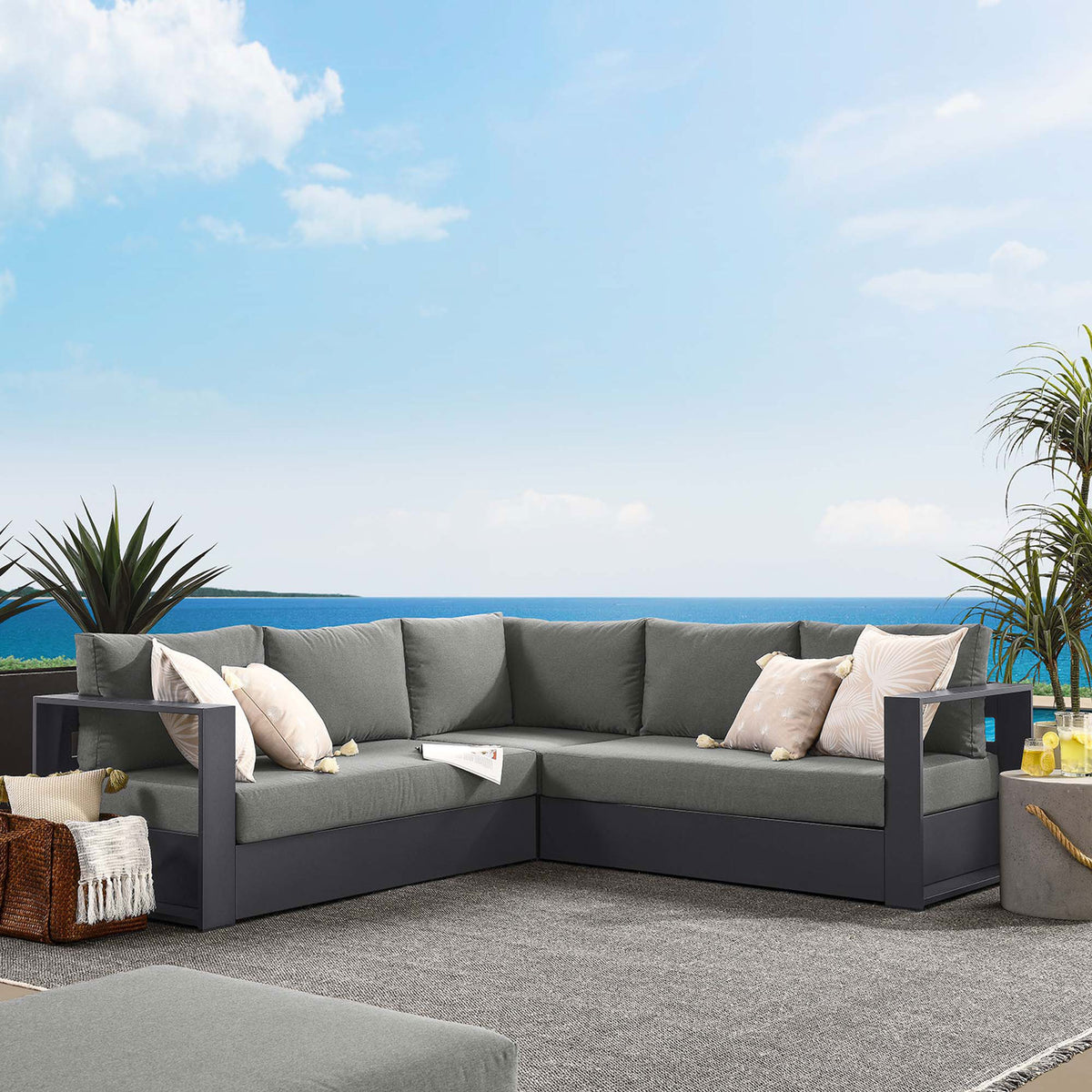 Charcoal Tahoe sectional styled on a modern patio creates an inviting outdoor lounge for family and guests || EEI-6668-GRY-CHA || front_room