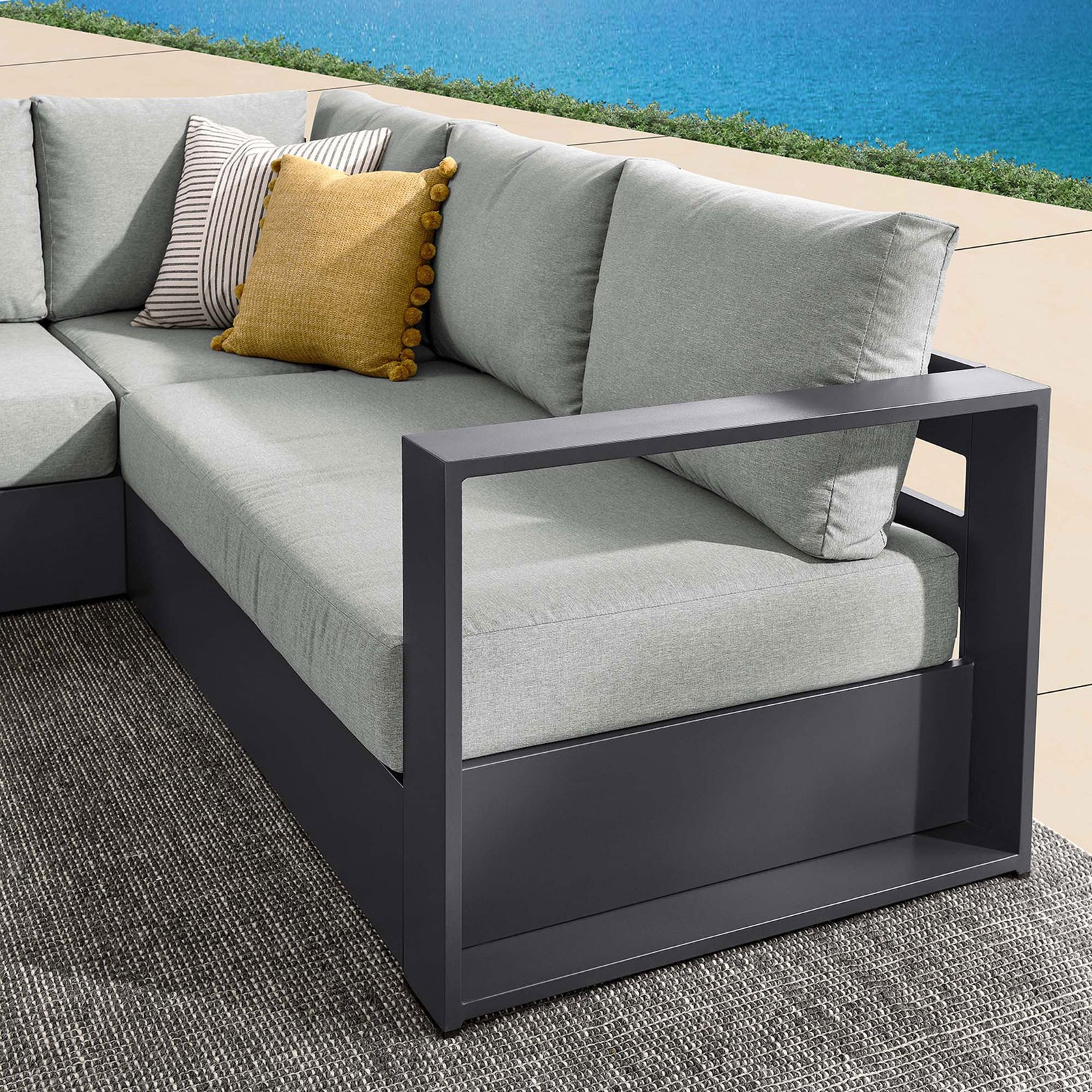 Gray armrest detail shows the sectionals open-frame arm design and inviting cushioned outdoor seating || EEI-6668-GRY-GRY || detail_room