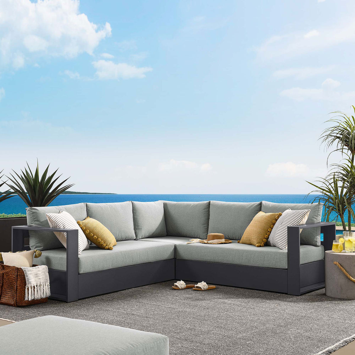 Gray Tahoe sectional styled on a sunlit patio creates a relaxed outdoor lounge for everyday gatherings || EEI-6668-GRY-GRY || front_room