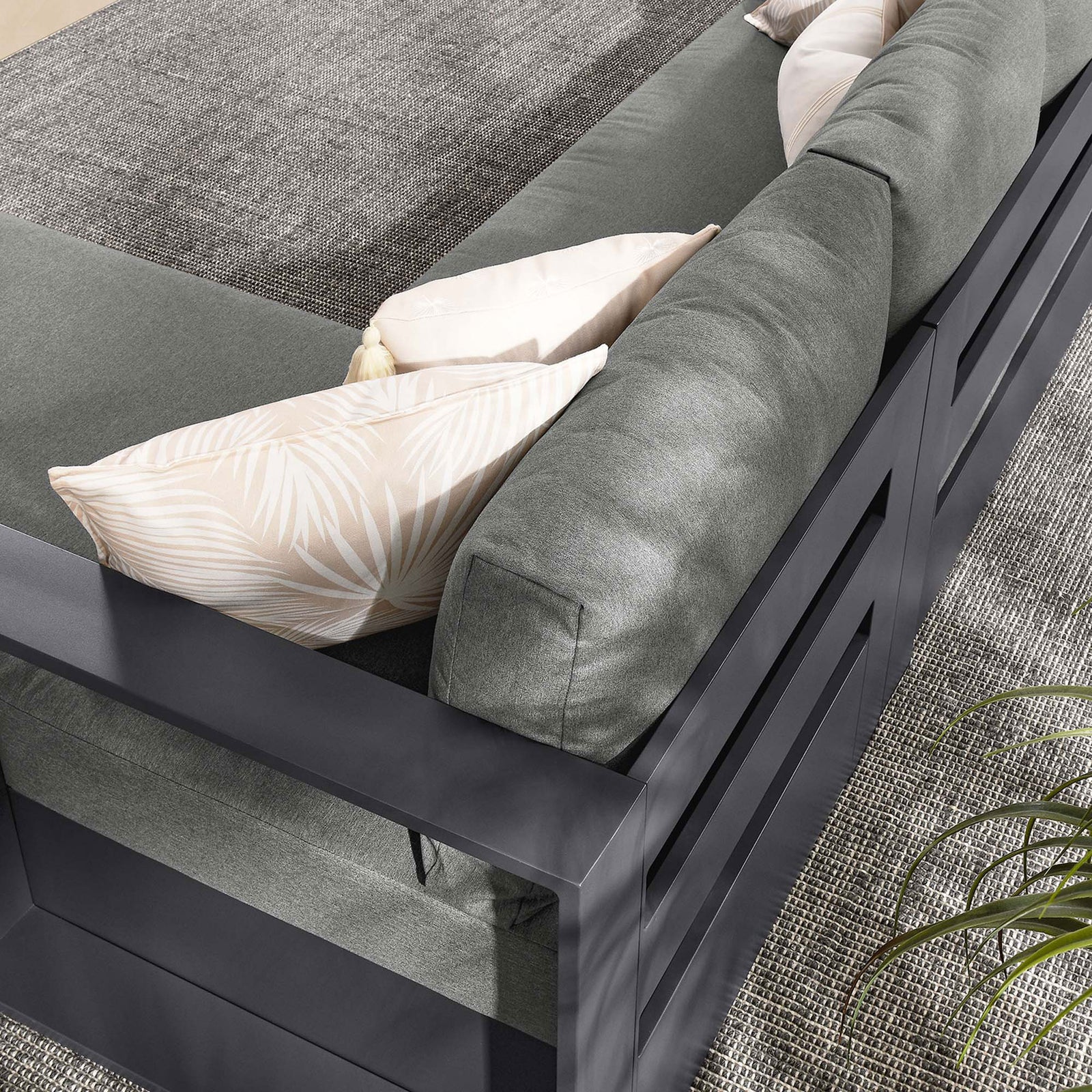 Back cushions and layered toss pillows create a plush lounge feel on the Tahoe sectional || EEI-6669-GRY-CHA || detail_room