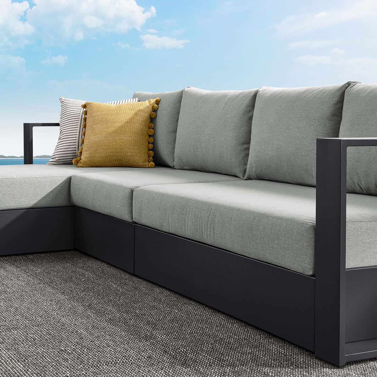 Light gray cushions and pillows on the sectional showing inviting texture and supportive comfort outdoors || EEI-6672-GRY-GRY || detail_room
