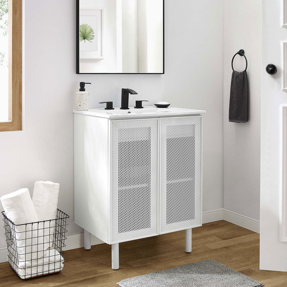Modern white vanity brightens the bath with clean lines and perforated door texture || EEI-6677-WHI-WHI || front_room