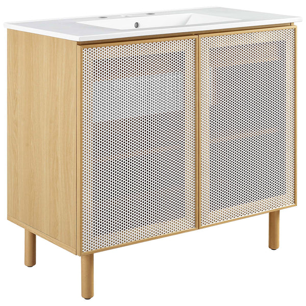 Wider vanity in white oak with perforated metal doors and ceramic sink brings a light, modern feel. || EEI-6678-WHI-OAK || front_angle_studio