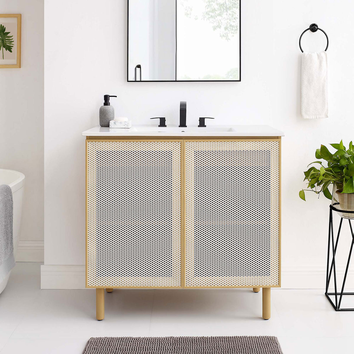Sleek white oak vanity elevates the bath with airy perforated doors and a bright ceramic basin. || EEI-6678-WHI-OAK || front_angle_room
