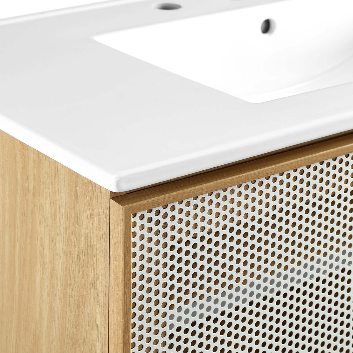 Fine edge where the glossy ceramic meets the warm oak frame for a refined finish. || EEI-6678-WHI-OAK || detail_studio