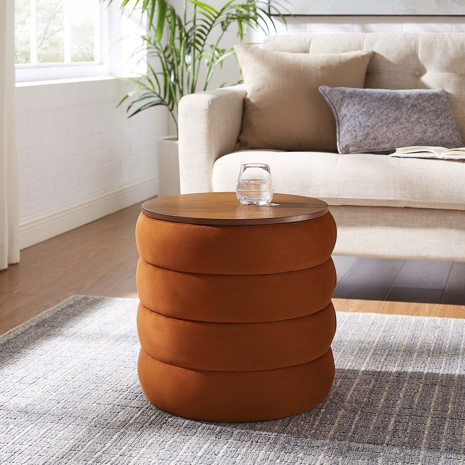 Rust velvet storage ottoman in a modern living room, used as a compact side table by the sofa || EEI-6684-RUS || front_angle_room