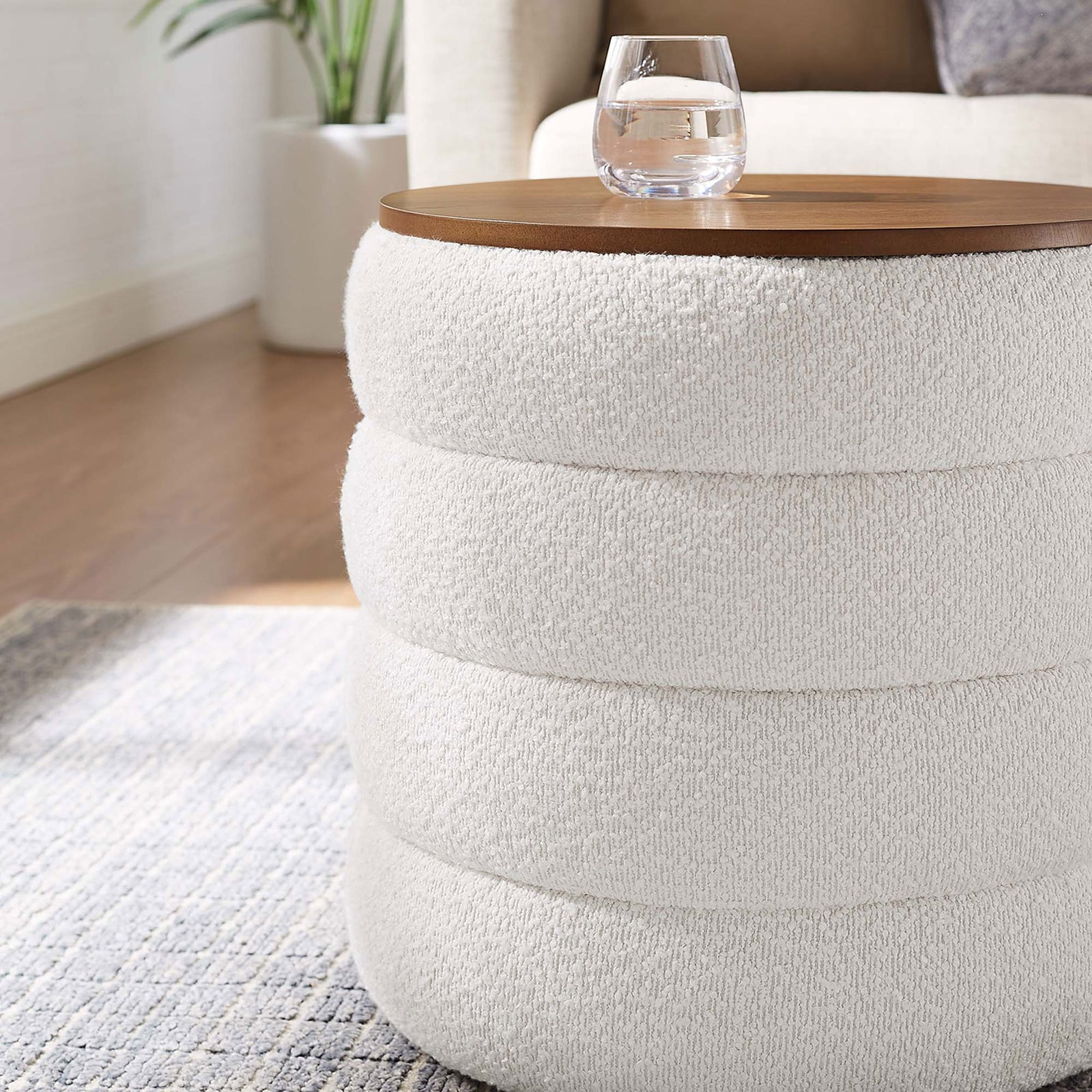 Cloud boucle storage ottoman beside a sofa, doubling as a compact accent table with wood top || EEI-6685-CLO || detail_room