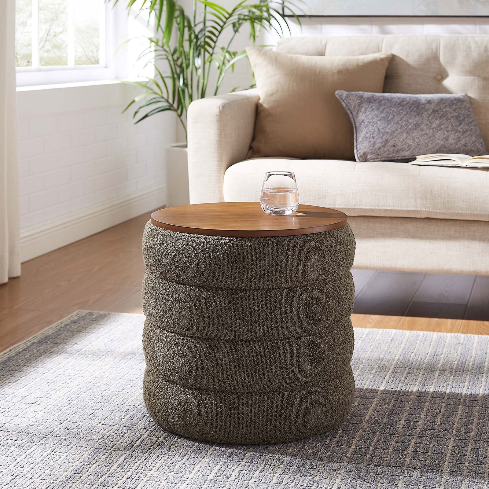 Pebble boucle storage ottoman with wood top serves as a cozy accent table in a modern living room || EEI-6685-PEB || front_angle_room