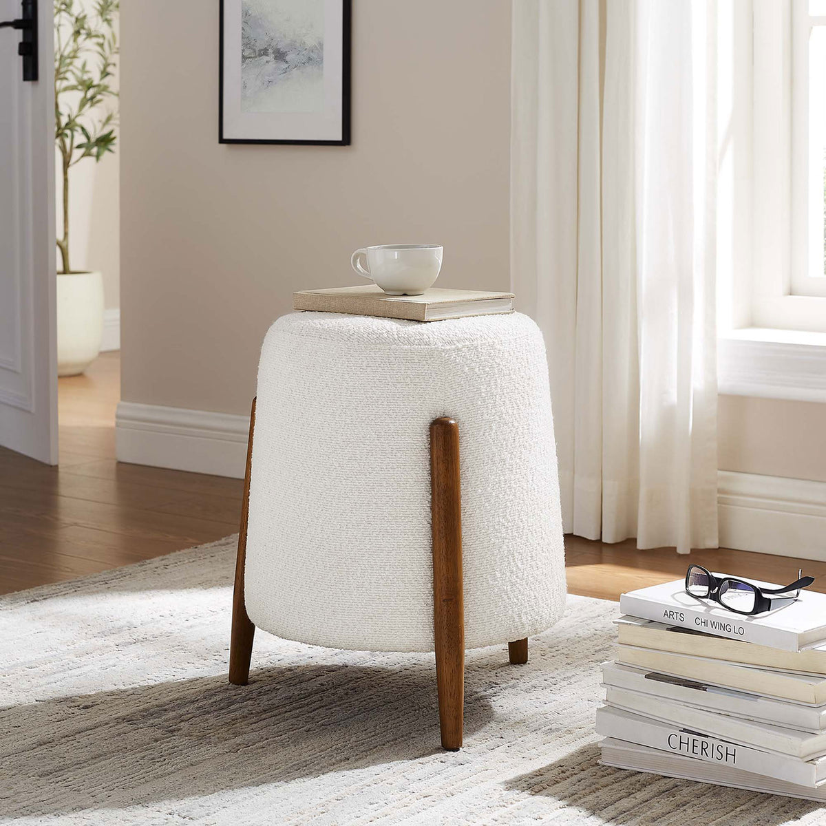 Versatile boucle ottoman serves as a stylish side table next to a windowed reading nook || EEI-6686-CLO || front_room