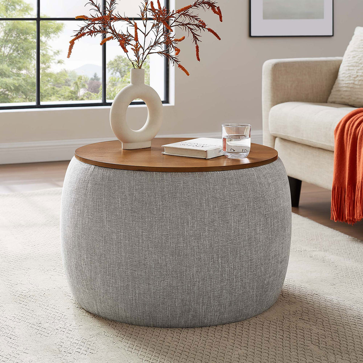 Heathered wheat storage ottoman doubles as a coffee table in a bright modern living room || EEI-6688-HEW || front_room