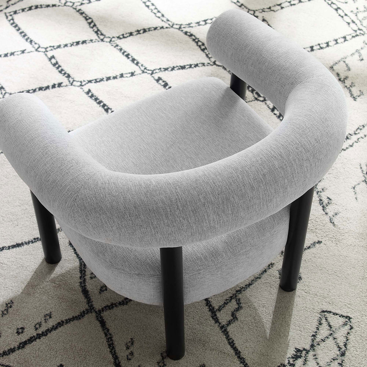 Open-back design and tailored fabric bring airy elegance to any seating area || EEI-6689-LGR-BLK || top_angle_room