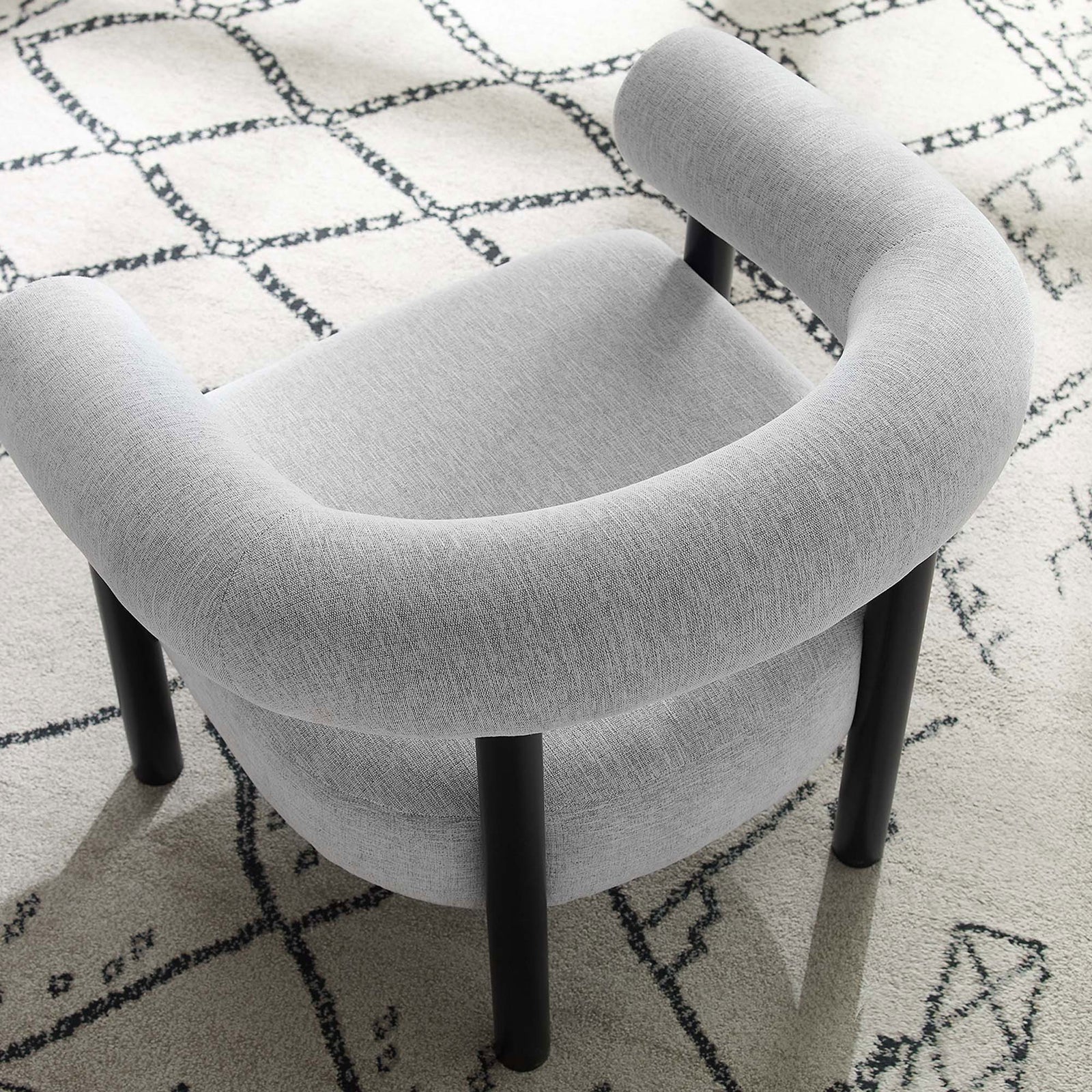 Open-back design and tailored fabric bring airy elegance to any seating area || EEI-6689-LGR-BLK || top_angle_room