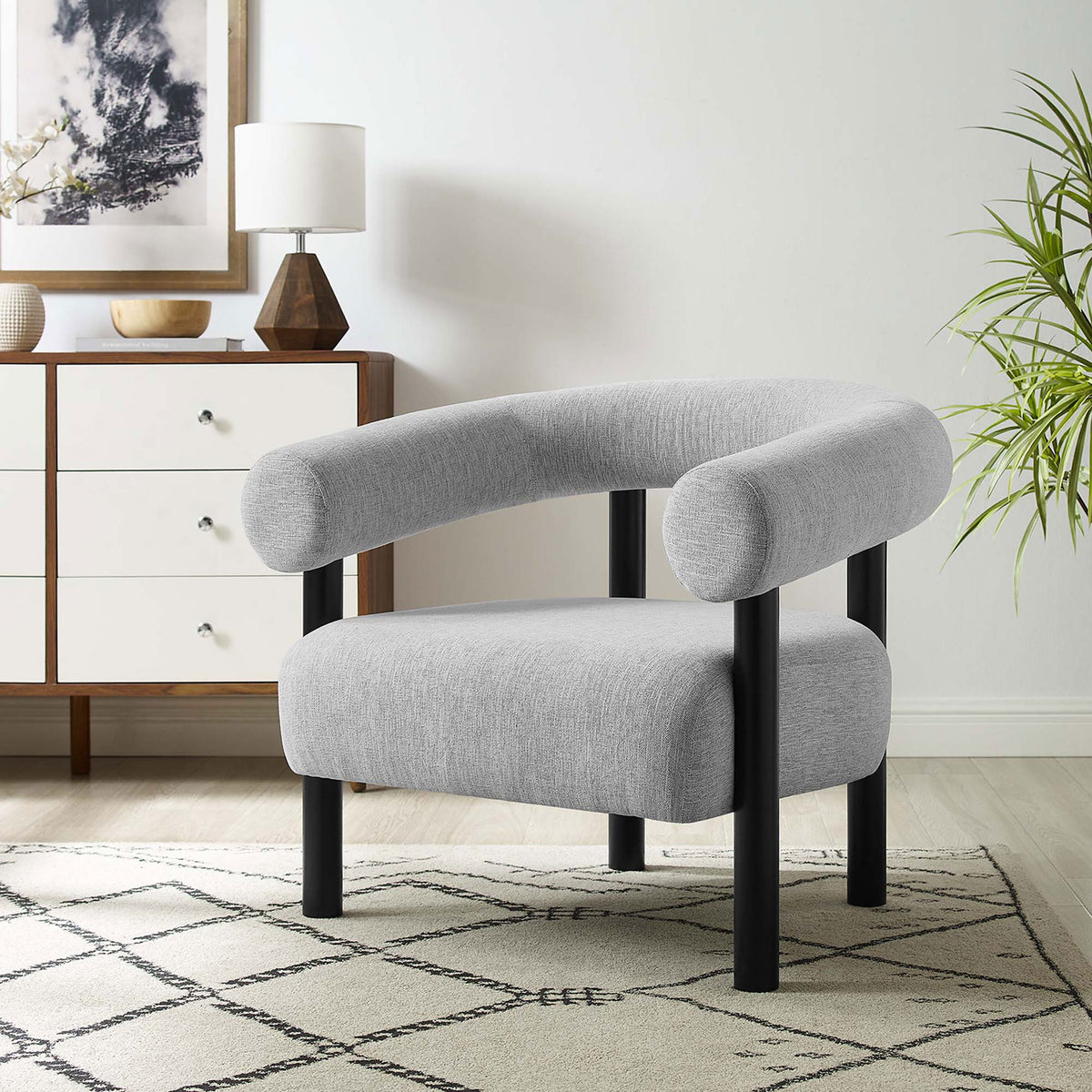 Elevates living spaces with a rounded profile, deep seat, and versatile light gray fabric || EEI-6689-LGR-BLK || front_angle_room
