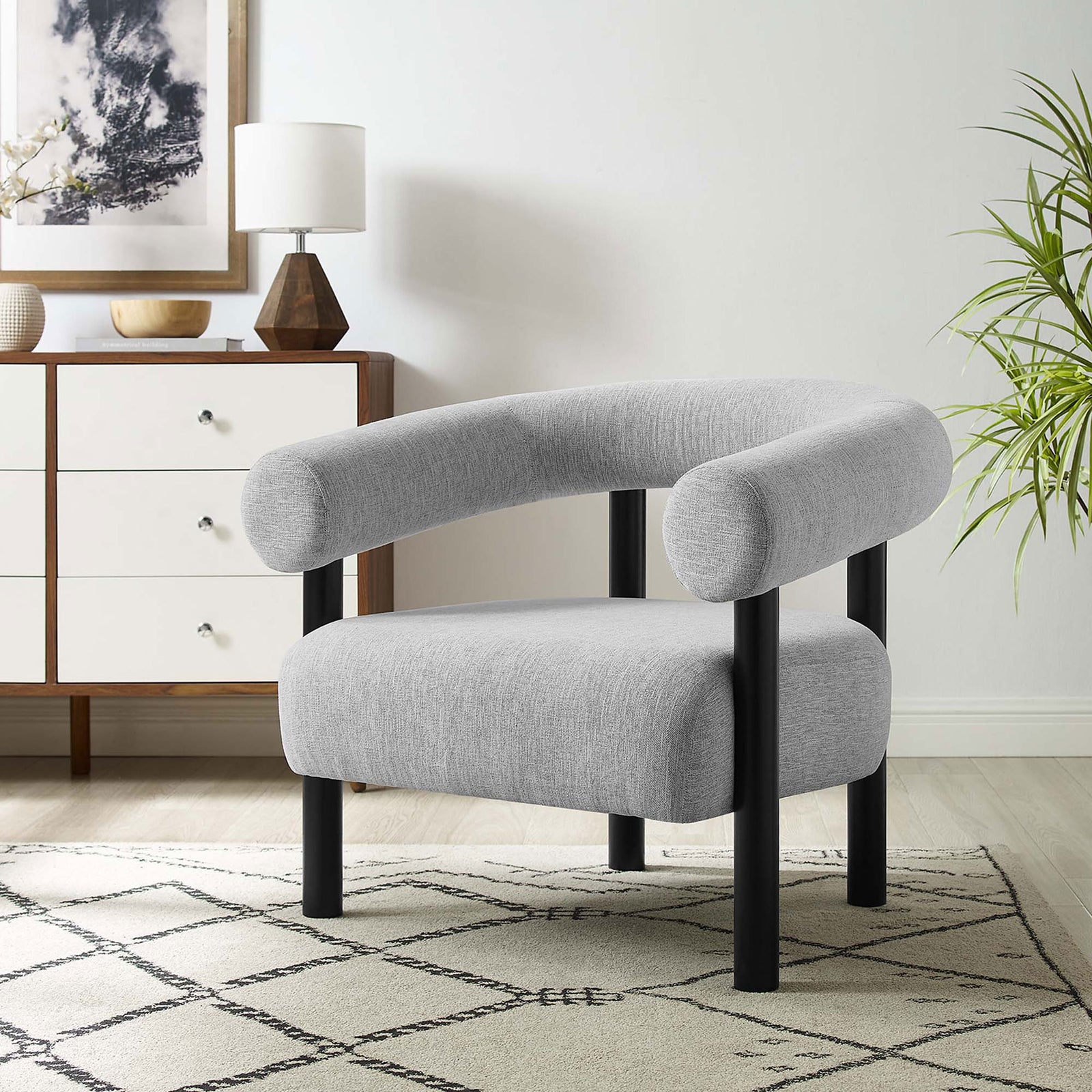 Elevates living spaces with a rounded profile, deep seat, and versatile light gray fabric || EEI-6689-LGR-BLK || front_angle_room
