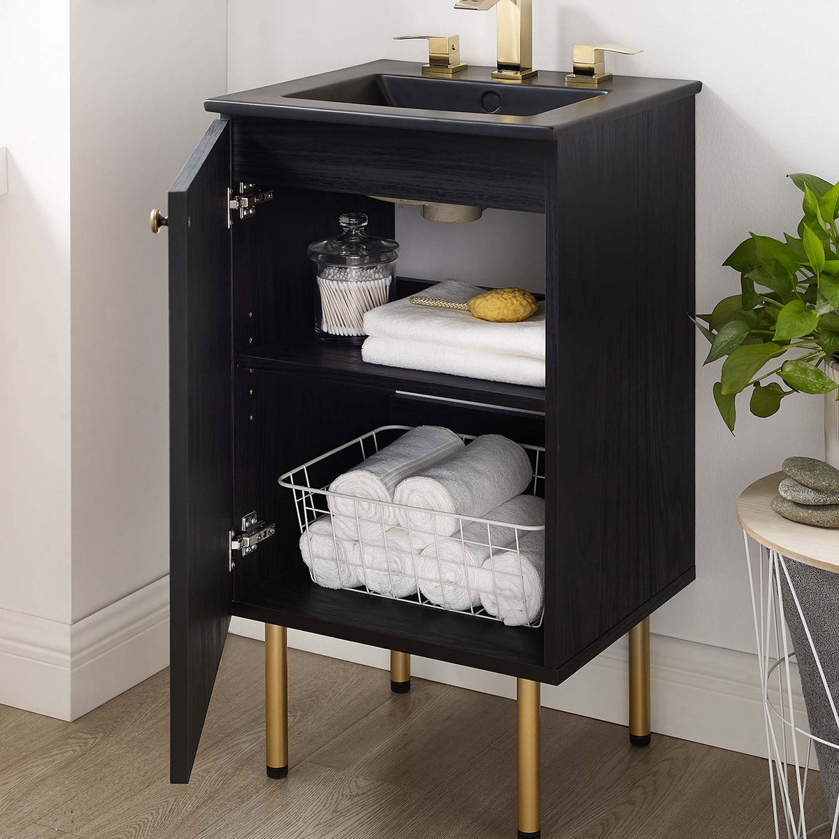 Door open to reveal adjustable storage, styled with towels beneath a matte black basin || EEI-6692-BLK-BLK || front_angle_open_room