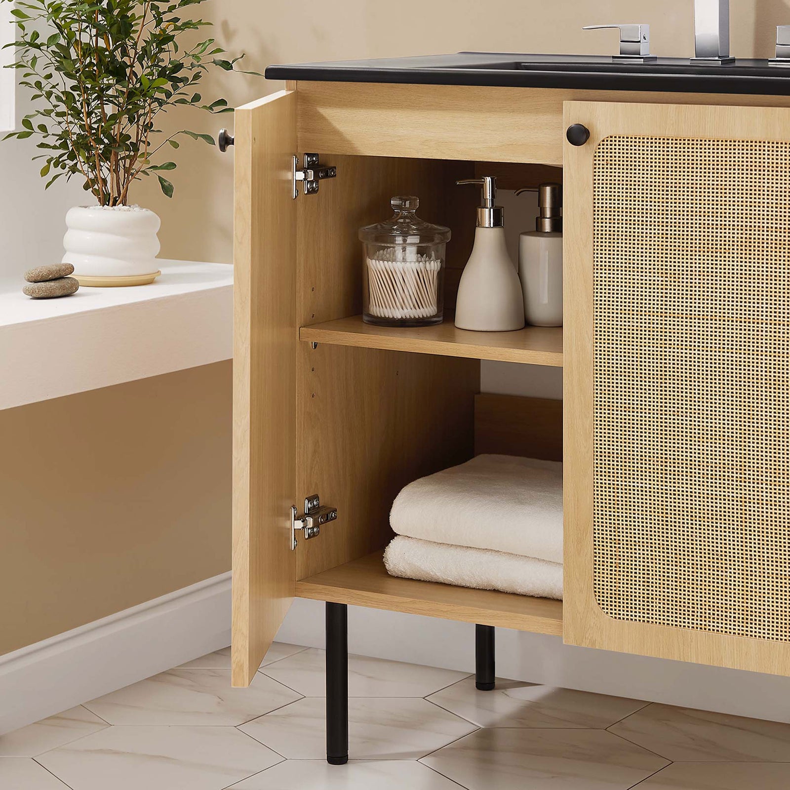 Handy interior storage keeps bath essentials tidy behind cane-paneled doors. || EEI-6696-OAK-BLK || storage_open_room
