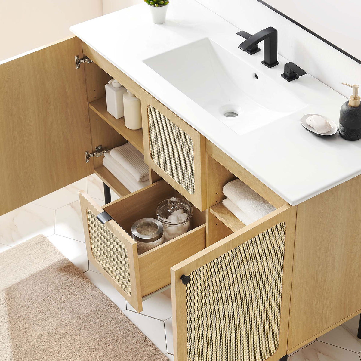 Adjustable shelves and a center drawer keep bathroom essentials organized. || EEI-6699-OAK-WHI || front_angle_open_room